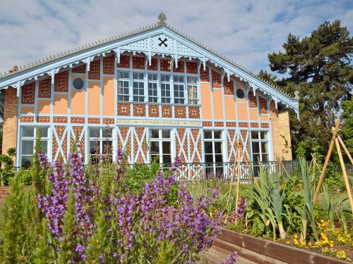 Vegetable and herb plots in front of a historic building